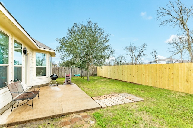 view of yard featuring a patio area and a fenced backyard