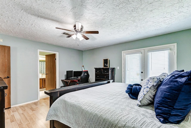 bedroom with ceiling fan, access to exterior, a textured ceiling, french doors, and light wood-style floors