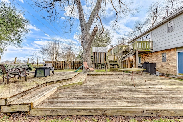 deck featuring fence and stairs