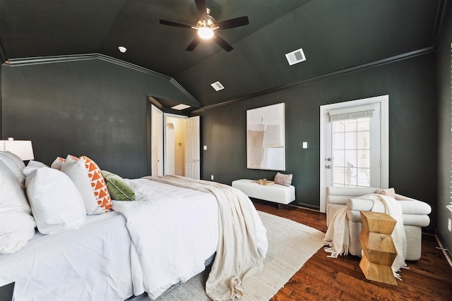 bedroom with lofted ceiling, visible vents, dark wood-type flooring, and ornamental molding