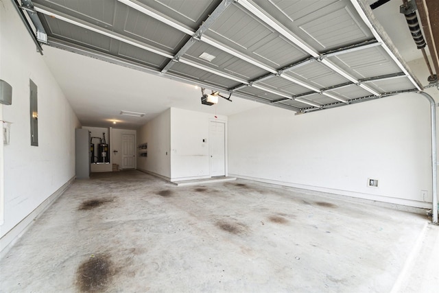 garage featuring water heater, electric panel, and a garage door opener