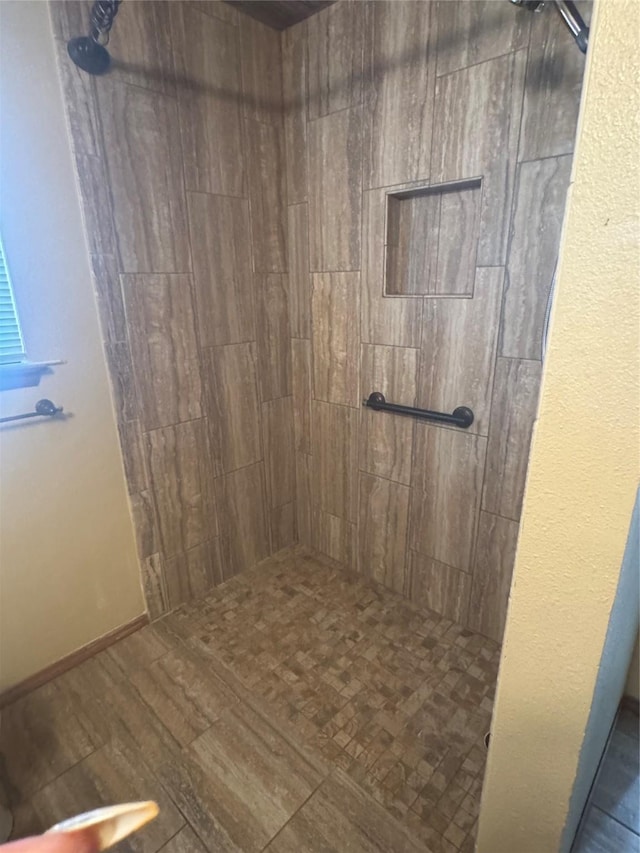 bathroom featuring tiled shower