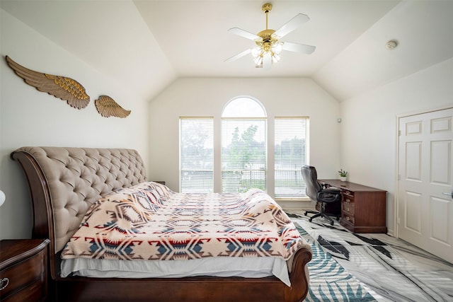 bedroom with a ceiling fan and vaulted ceiling