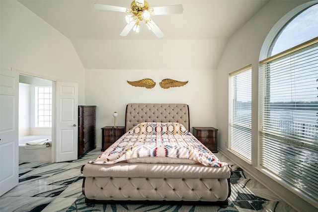 bedroom featuring marble finish floor, vaulted ceiling, and a ceiling fan