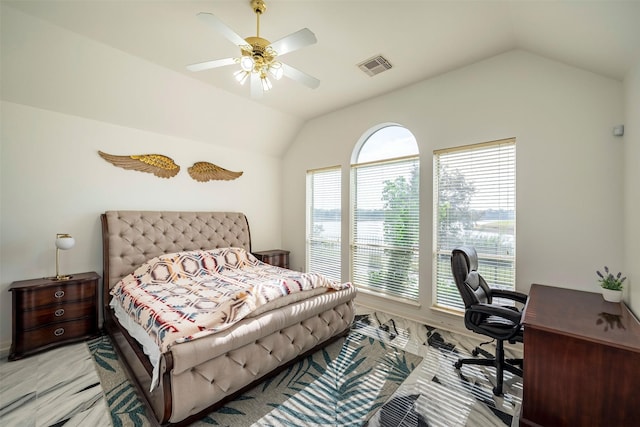 bedroom featuring lofted ceiling, visible vents, and a ceiling fan