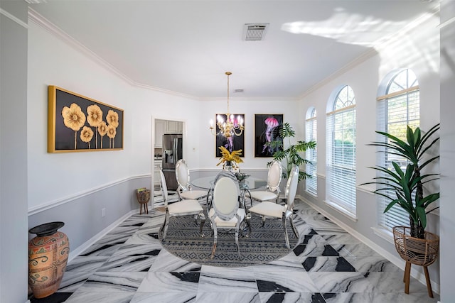 dining space featuring baseboards, crown molding, visible vents, and a notable chandelier