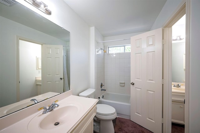 full bathroom featuring toilet, bathtub / shower combination, visible vents, and vanity