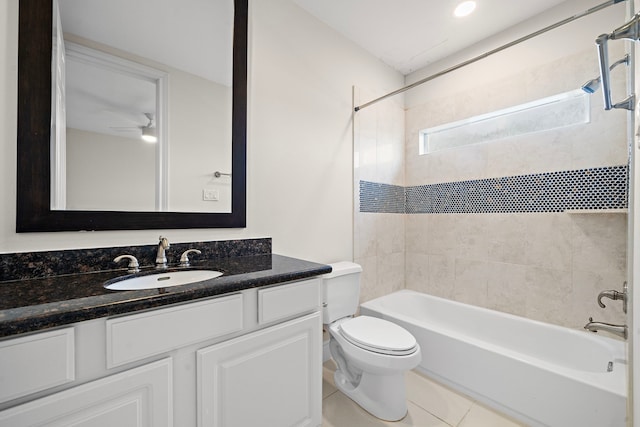 bathroom with tile patterned flooring, toilet, vanity, and washtub / shower combination