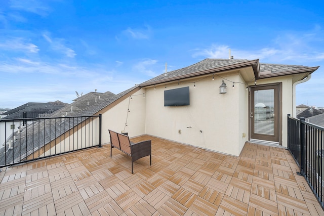 view of patio featuring a balcony