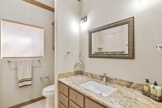 bathroom featuring tile patterned flooring, vanity, and toilet