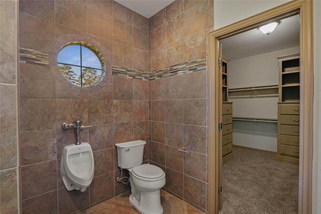 full bathroom featuring toilet and a walk in closet