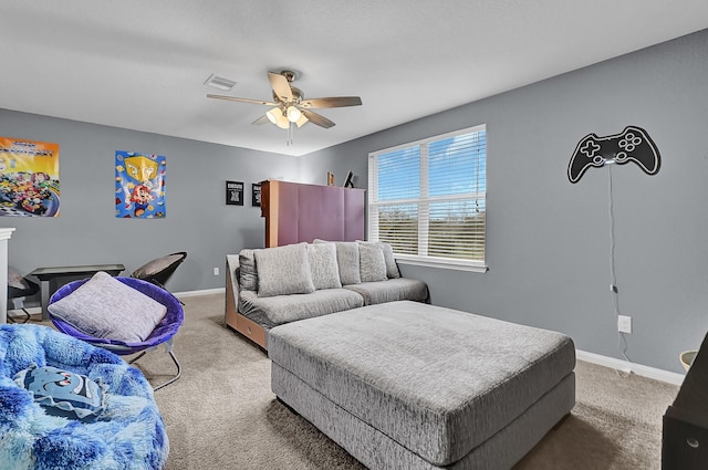 carpeted bedroom with ceiling fan, visible vents, and baseboards