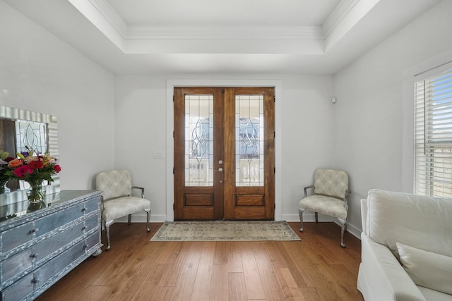 entryway with baseboards, a tray ceiling, dark wood-type flooring, and french doors