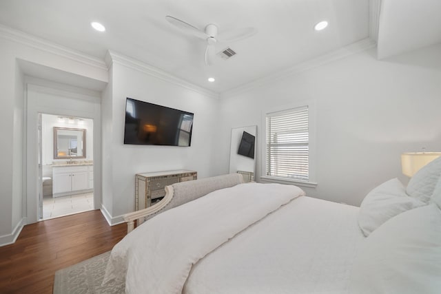 bedroom featuring dark wood-type flooring, visible vents, and crown molding