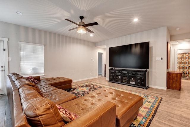 living room with recessed lighting, ceiling fan, light wood finished floors, and baseboards