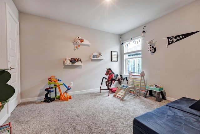 rec room with carpet floors and baseboards