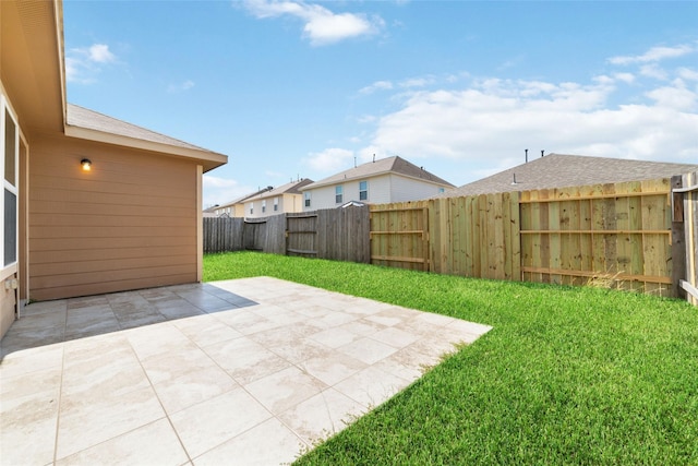 view of yard with a patio area and a fenced backyard