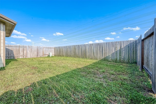 view of yard with a fenced backyard