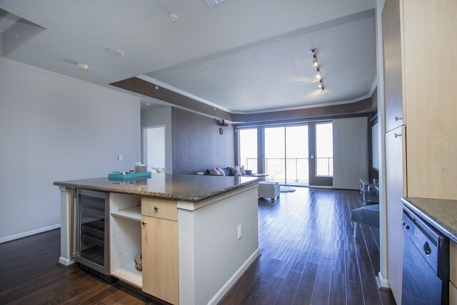 kitchen featuring dark wood-style flooring, open floor plan, light brown cabinets, beverage cooler, and dishwashing machine