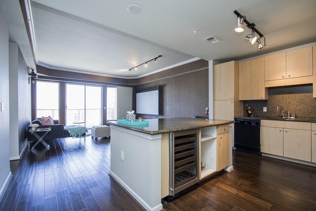 kitchen with light brown cabinets, beverage cooler, visible vents, open floor plan, and dishwasher