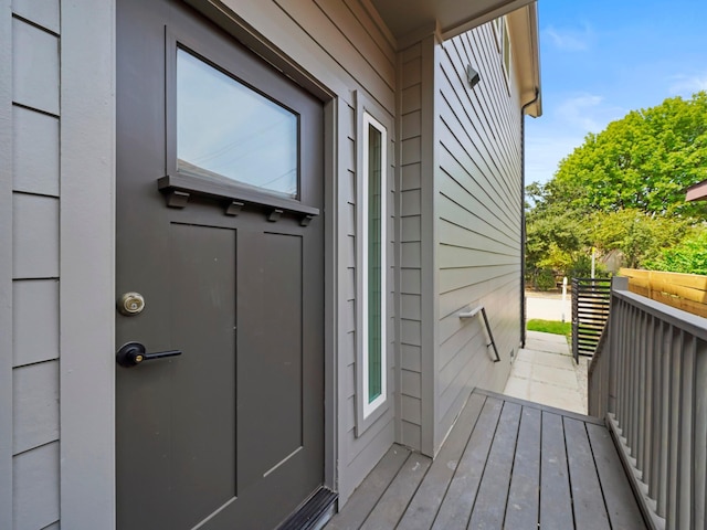 view of exterior entry with a standing seam roof