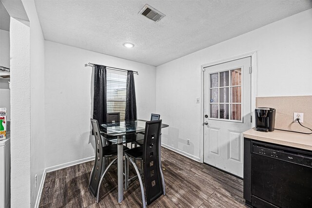 dining area featuring dark wood-style floors, baseboards, and visible vents