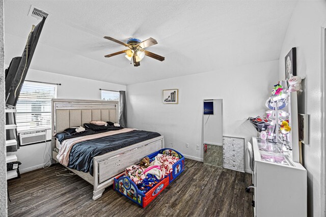 bedroom with a textured ceiling, ceiling fan, dark wood-style flooring, visible vents, and baseboards