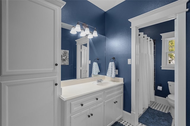 full bath with a shower with shower curtain, toilet, vanity, tile patterned flooring, and baseboards