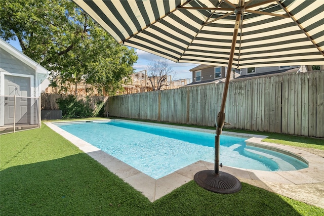 view of pool with a fenced backyard, a fenced in pool, and a yard