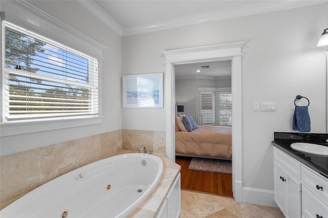 ensuite bathroom with tile patterned flooring, connected bathroom, vanity, a tub with jets, and crown molding