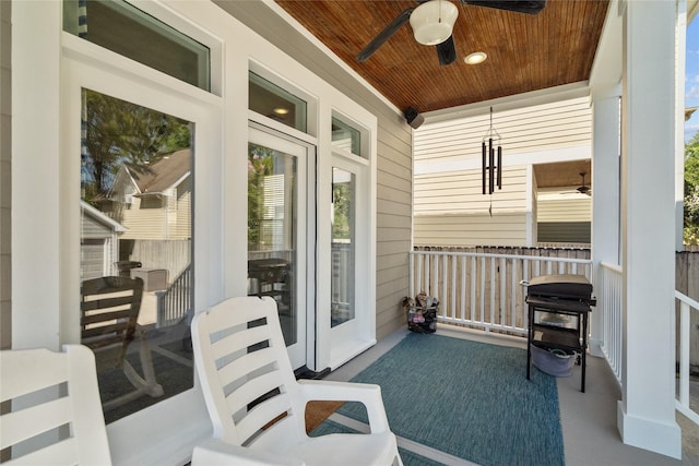 balcony featuring covered porch and ceiling fan