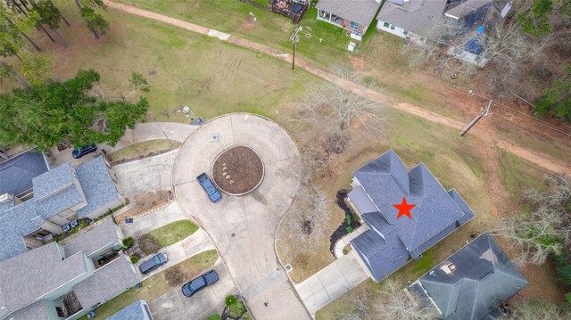 birds eye view of property with a residential view