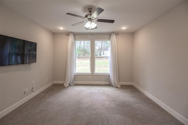 spare room with ceiling fan, recessed lighting, carpet, and baseboards