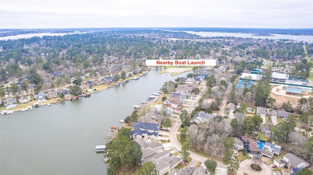 bird's eye view with a water view and a residential view