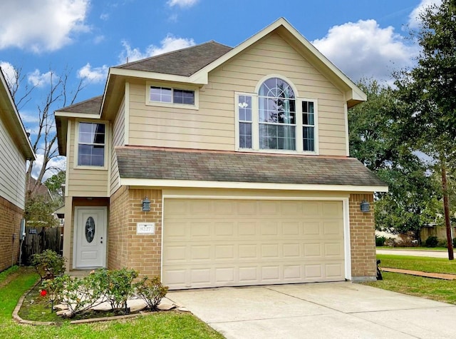 view of front of home featuring driveway, brick siding, roof with shingles, and an attached garage