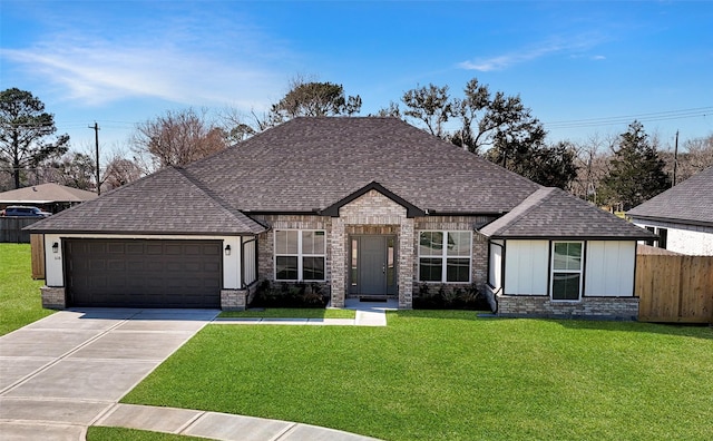 view of front facade featuring an attached garage, roof with shingles, concrete driveway, and a front lawn