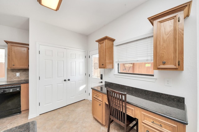 office featuring light tile patterned floors and built in desk