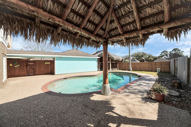 view of pool with a fenced in pool, a patio area, a fenced backyard, and a gazebo