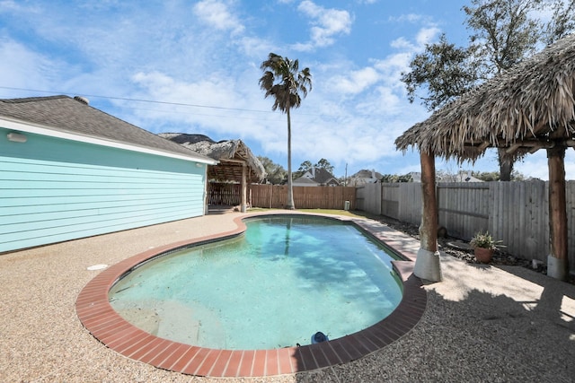 view of pool featuring a patio and a fenced backyard