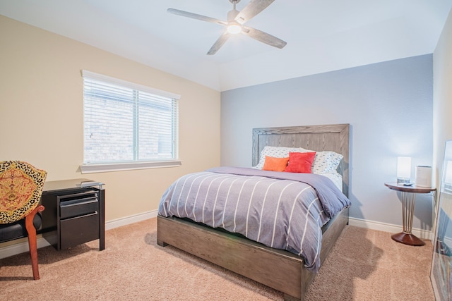 bedroom featuring lofted ceiling, ceiling fan, baseboards, and light colored carpet