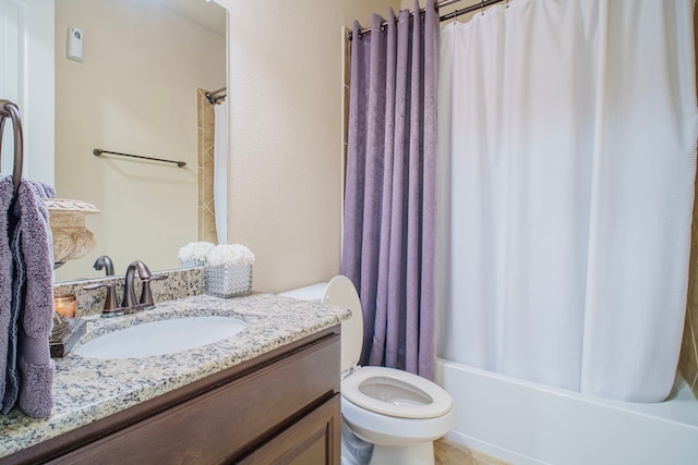 bathroom with toilet, shower / bathtub combination with curtain, and vanity