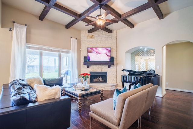 living area with baseboards, coffered ceiling, dark wood-style flooring, beamed ceiling, and a fireplace