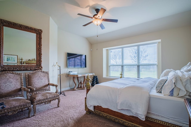 bedroom with lofted ceiling, ceiling fan, baseboards, and carpet flooring