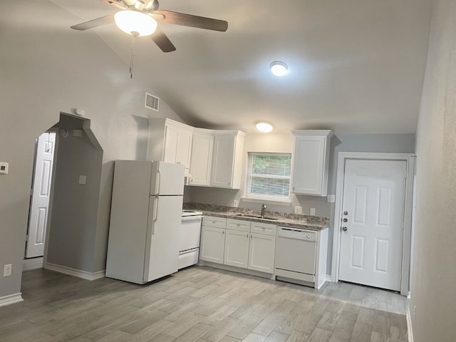 kitchen featuring white appliances, visible vents, white cabinetry, and a sink