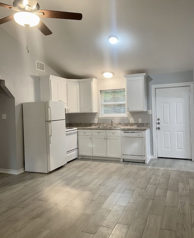 kitchen featuring white appliances, a sink, visible vents, and white cabinets