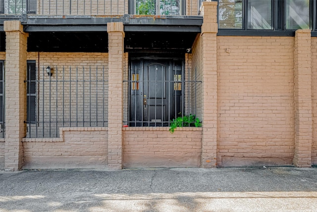 exterior space with brick siding