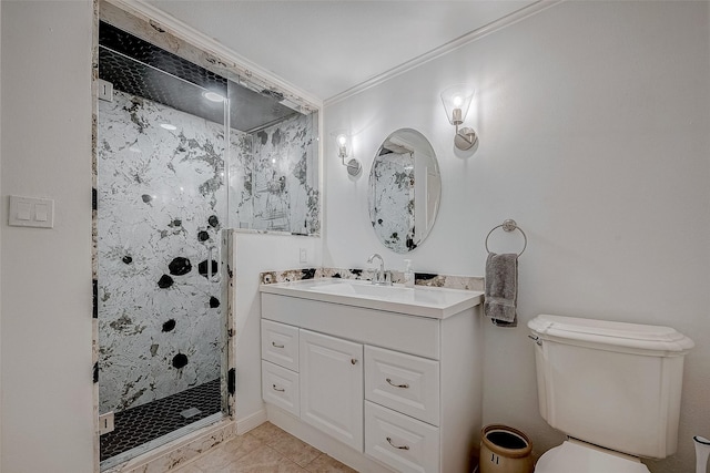 bathroom featuring toilet, tile patterned floors, crown molding, vanity, and a shower stall