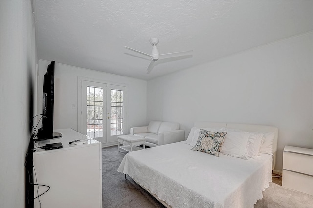 bedroom with carpet floors, access to exterior, french doors, and a ceiling fan