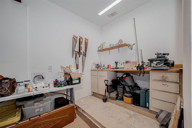 office area featuring visible vents and concrete flooring