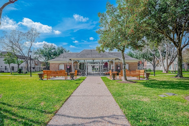 surrounding community featuring a yard and fence